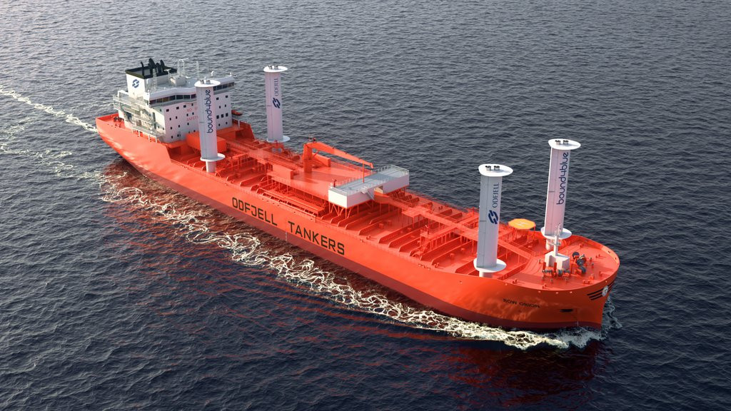 Chemical tanker with four vertical wind propulsion rotors sailing at sea